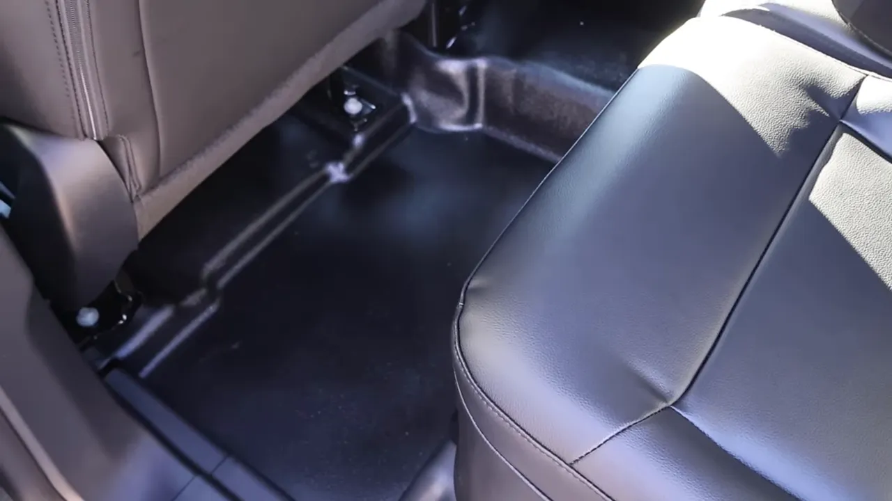 Rear detainee area showing a vinyl seat, seat brackets and hard floor covering in the 2026 Ford Explorer Interceptor.