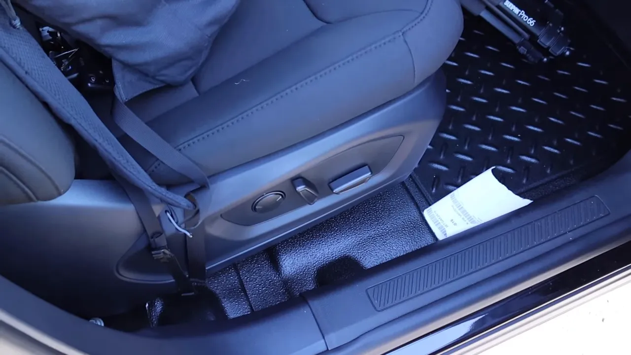 Driver seat side showing power seat controls, reinforced hard floor and upfit equipment in a 2026 Ford Explorer Interceptor