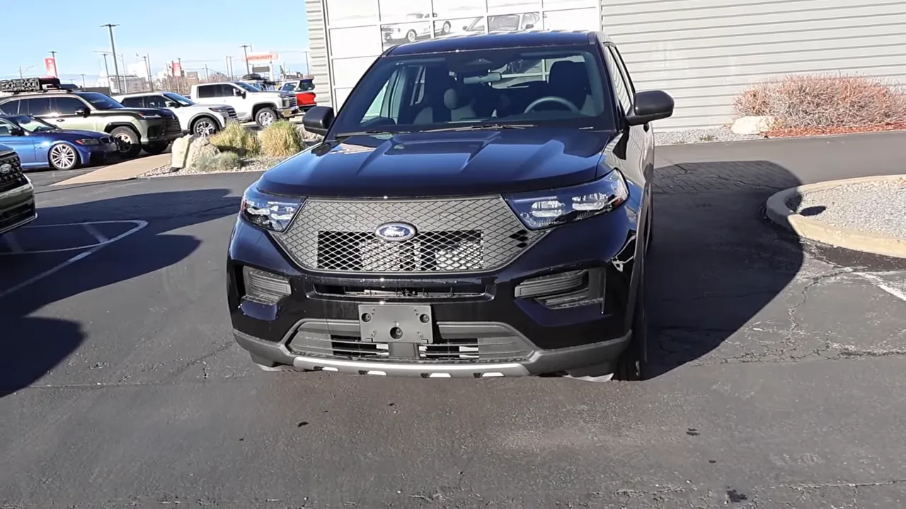 well lit front view of 2026 ford explorer police interceptor showing grille hood and headlights