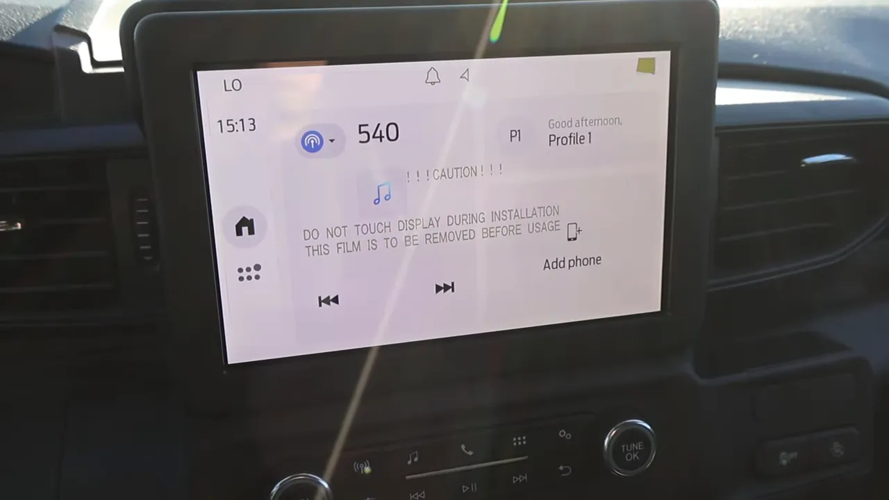 Front center stack of 2026 Ford Explorer Interceptor showing infotainment screen, volume and tune knobs and climate control below