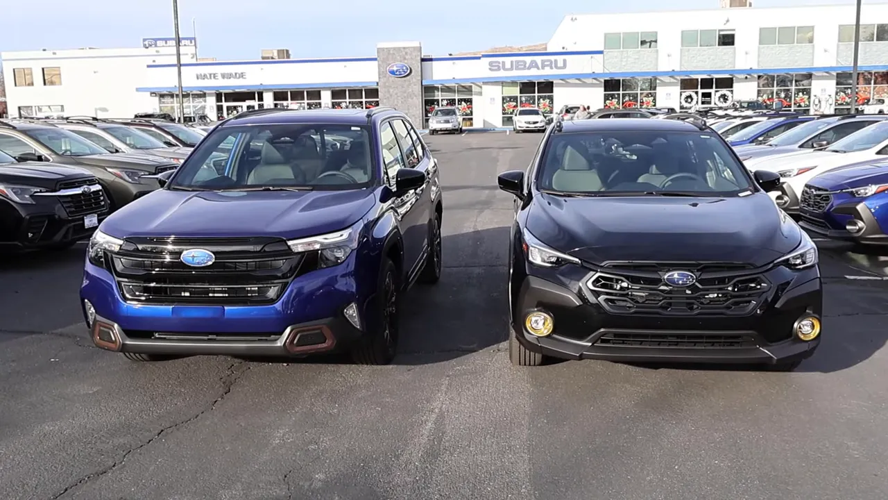 Crosstrek (left) and Forester (right) parked front-on at a Subaru dealership showing size and styling contrast