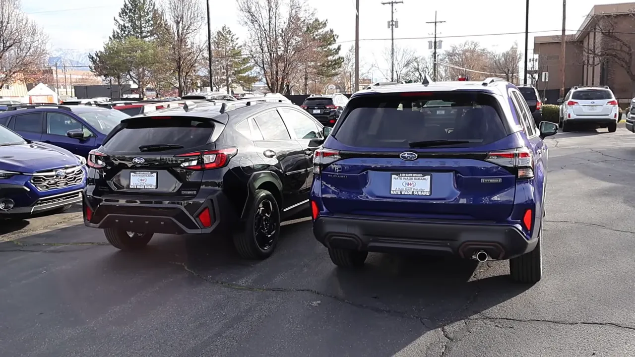 Two Subaru SUVs parked side-by-side viewed from the rear, highlighting different rear height and cargo openings