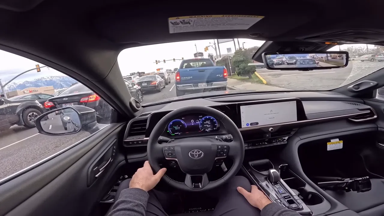 Wide, centered interior shot of 2026 Toyota Crown Signia showing long dashboard, steering wheel and infotainment screen