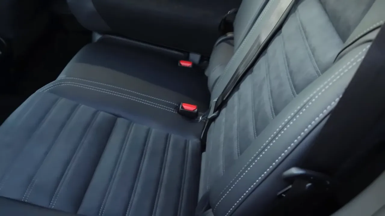 Rear seat of 2026 Mitsubishi Outlander Trail Edition showing suede inserts and contrast stitching
