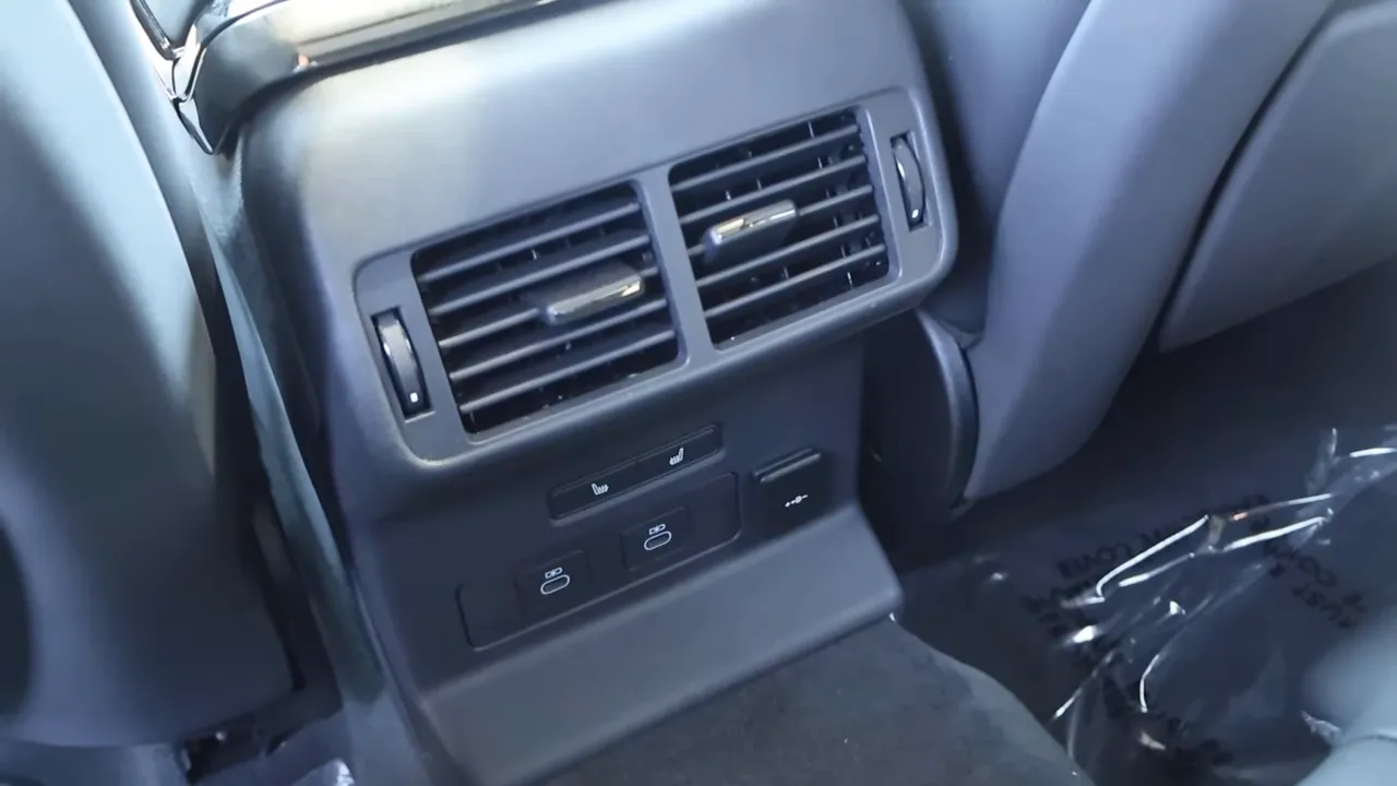 Rear HVAC vents, USB charging ports and heated-seat controls in Range Rover Velar rear console