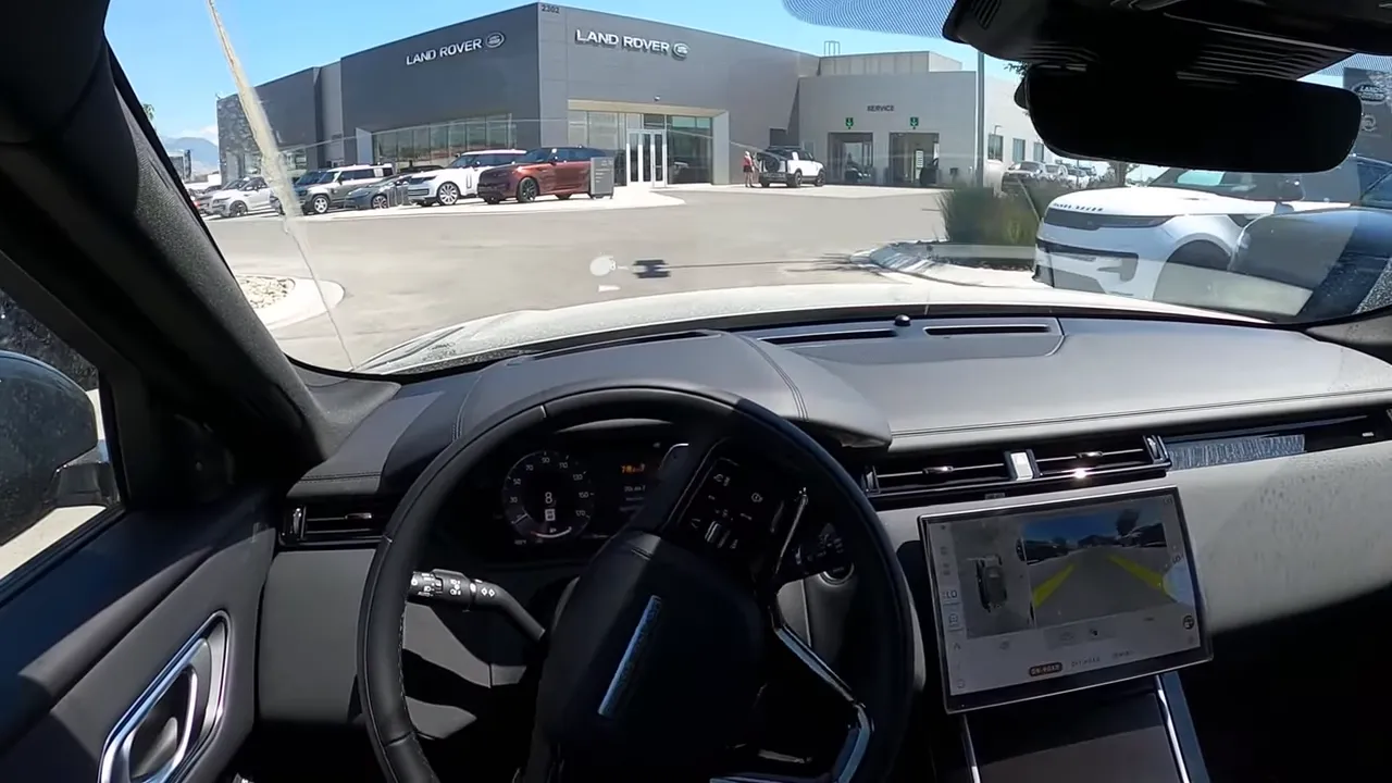 Wide Range Rover Velar cockpit with central touchscreen and heads-up display