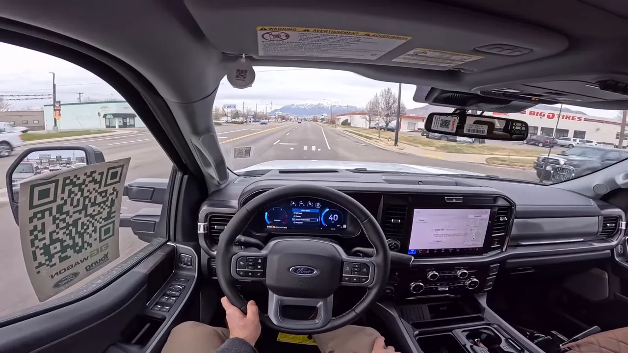 Centered driver perspective of AG Wagon interior with clear windshield and digital instrument cluster, highlighting cabin view and road ahead