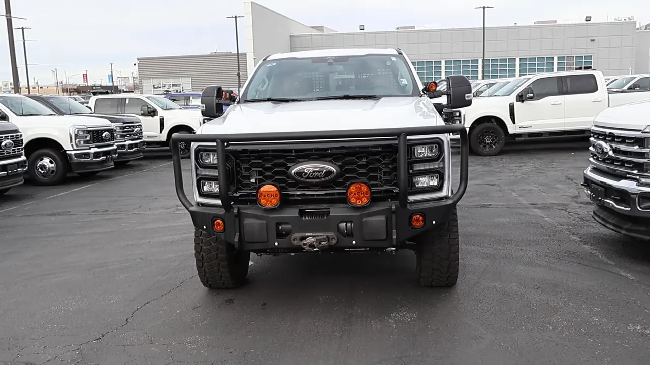 Full frontal image of AG Wagon showcasing heavy brush guard, front-mounted winch and round amber auxiliary lights
