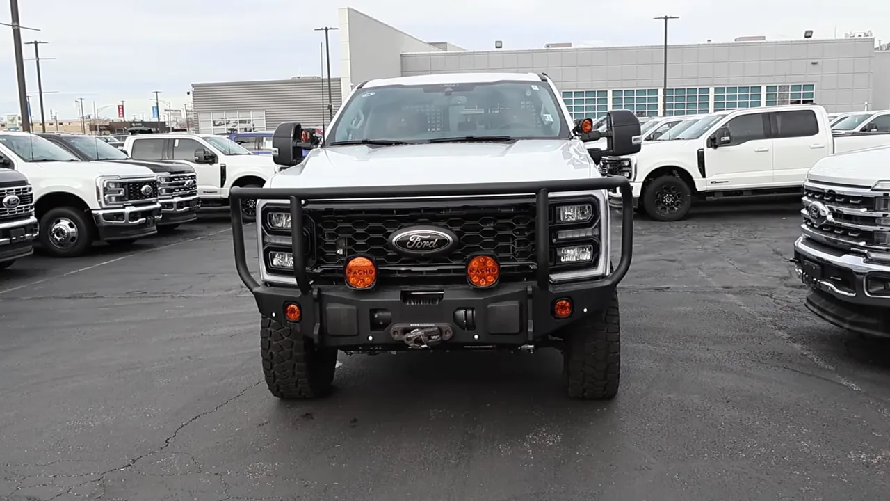 Full frontal image of AG Wagon showcasing heavy brush guard, front-mounted winch and round amber auxiliary lights