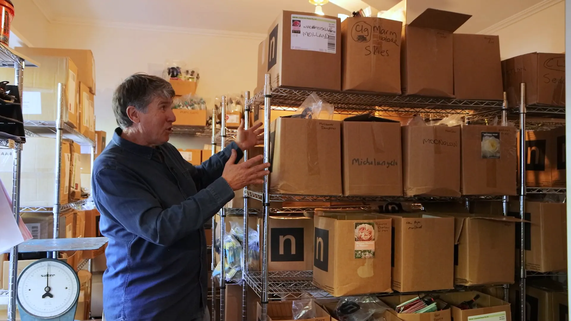 Kim Syrus introduces the storage boxes filled with rose labels.