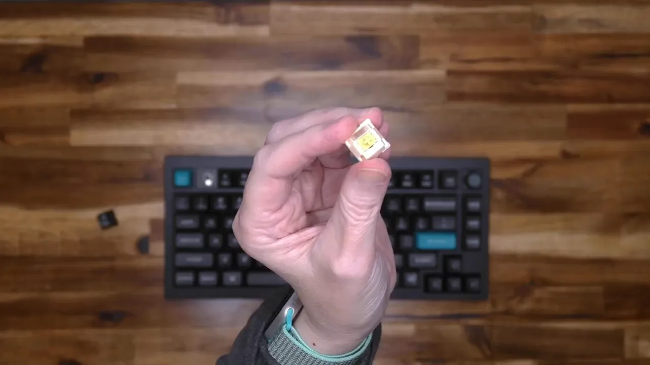 Close-up of a mechanical switch with visible LED inside a transparent housing illustrating south-facing RGB.