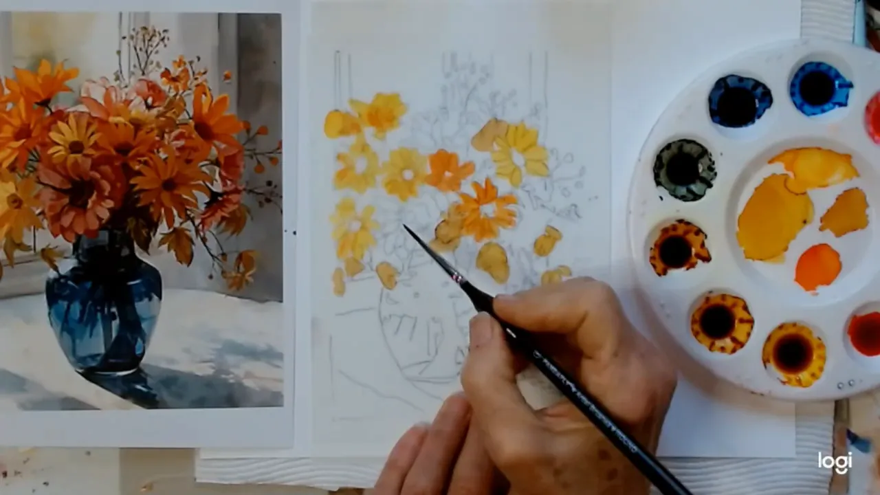 Artist's hand holding a brush blocking in orange-yellow petals on a sketched floral composition with the palette visible at right.