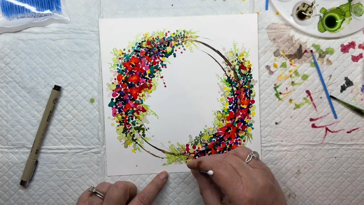 Final details and signing the alcohol ink wreath painting