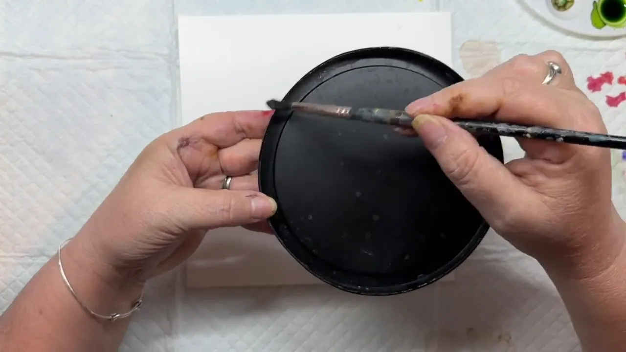 Applying Teakwood brown ink along the edges of the paper