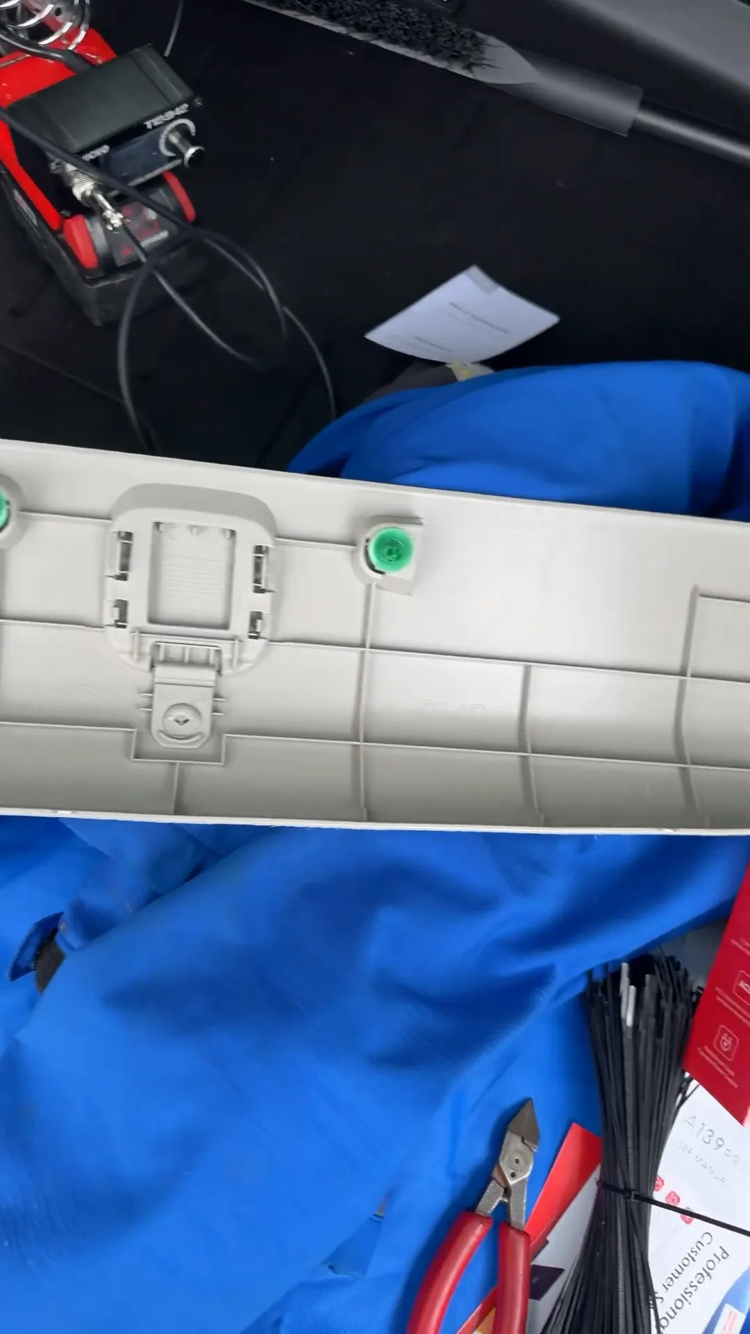 Removing the top hatch panel to expose wiring.