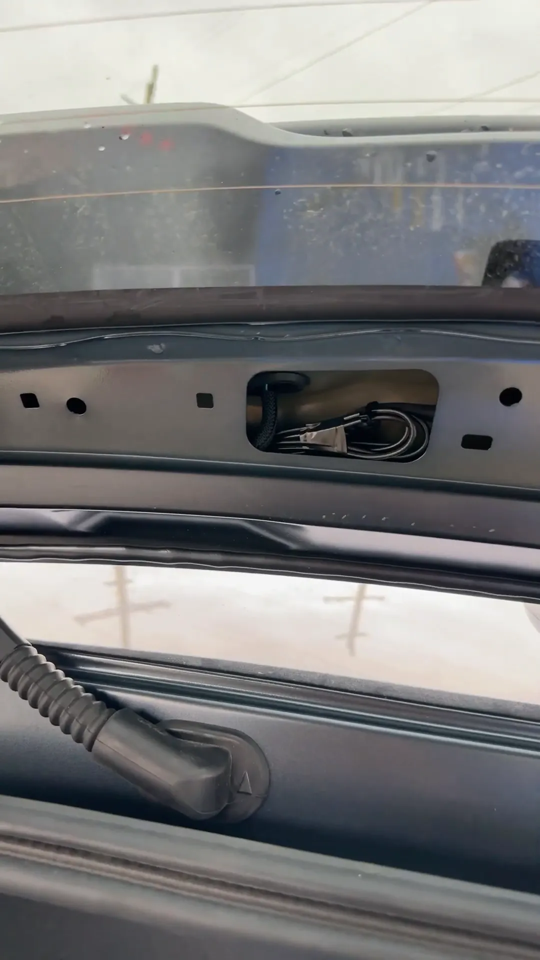 Camera mounted with excess wiring secured.
