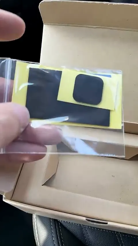 Dash cam mounted on a windshield with fresh adhesive pad