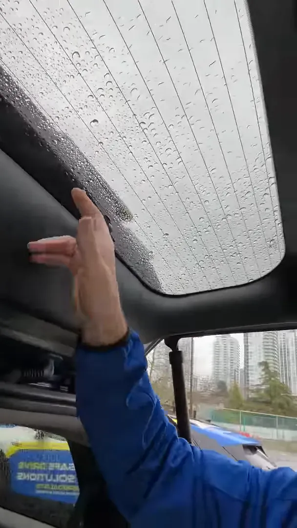 rear windshield wiper cleaned band with hand indicating camera placement on Hyundai Santa Fe 2024