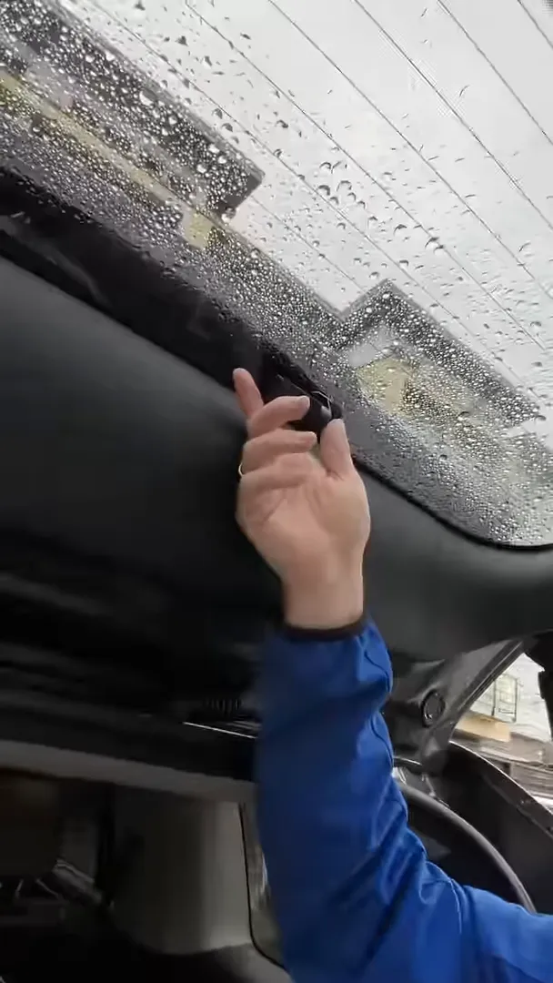 Detailed view of Hyundai Santa Fe rear wiper mount and raindrop pattern on glass