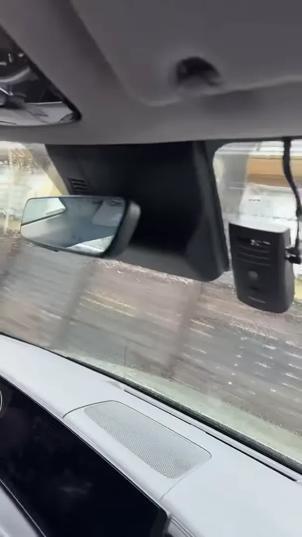 Front dash camera mounted on the passenger side of a 2024 Hyundai Santa Fe windshield near the rearview mirror