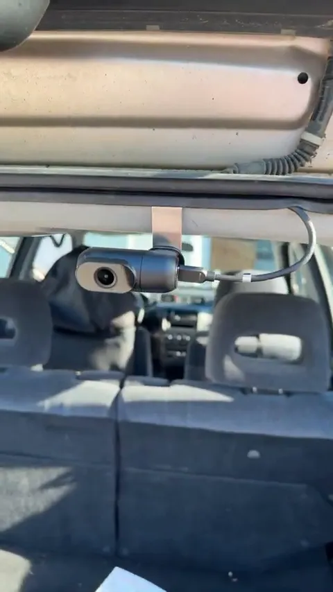 Rear camera mounted inside rear window, protected from elements