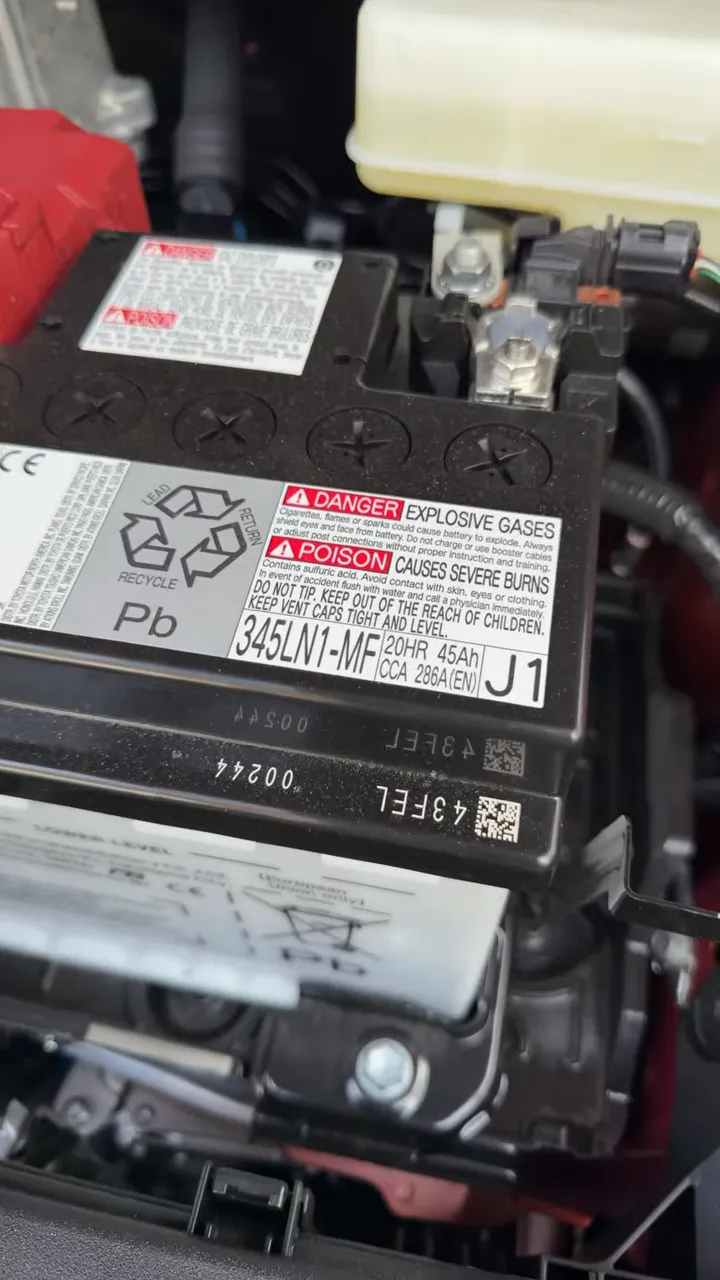 Close view of the vehicle battery label showing specifications including 286 CCA
