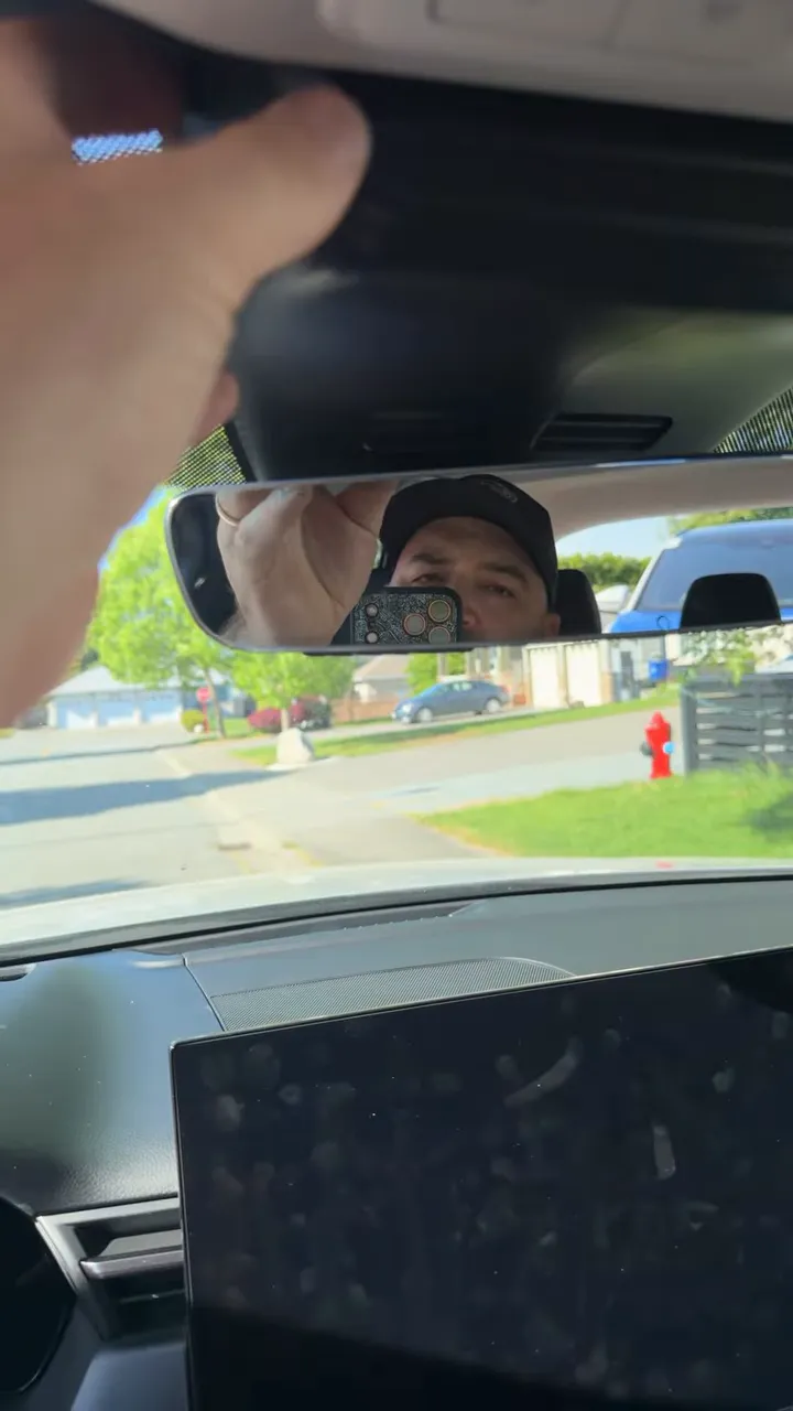 Installing a front dash camera on the rearview mirror area of a 2026 Mazda CX-5
