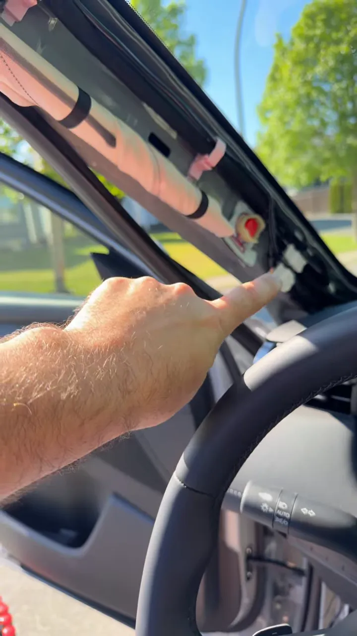 Checking secure dash cam wiring placement on the 2026 Mazda CX-5 A-pillar