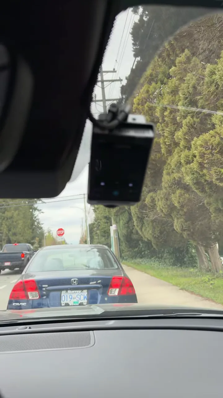 Hyundai Tucson dash camera unit mounted near the rearview mirror on the windshield