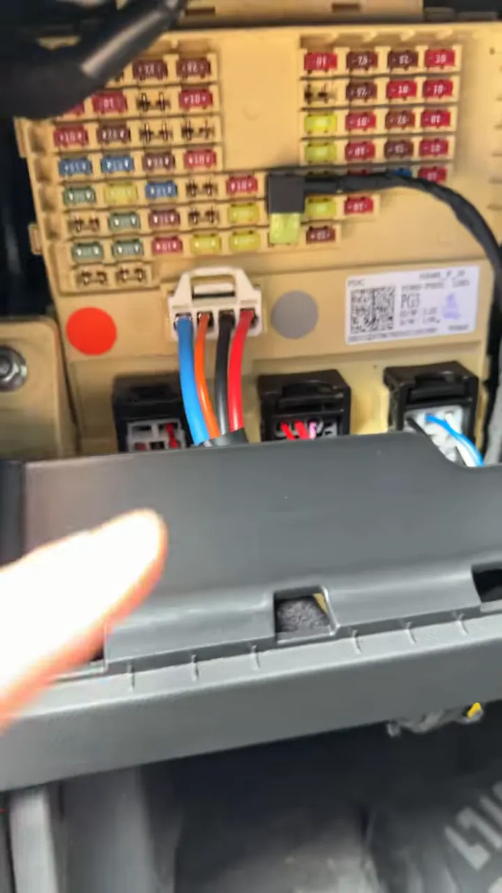 Close-up of fuse box with dash cam power wiring connections in 2026 Hyundai Tucson Hybrid