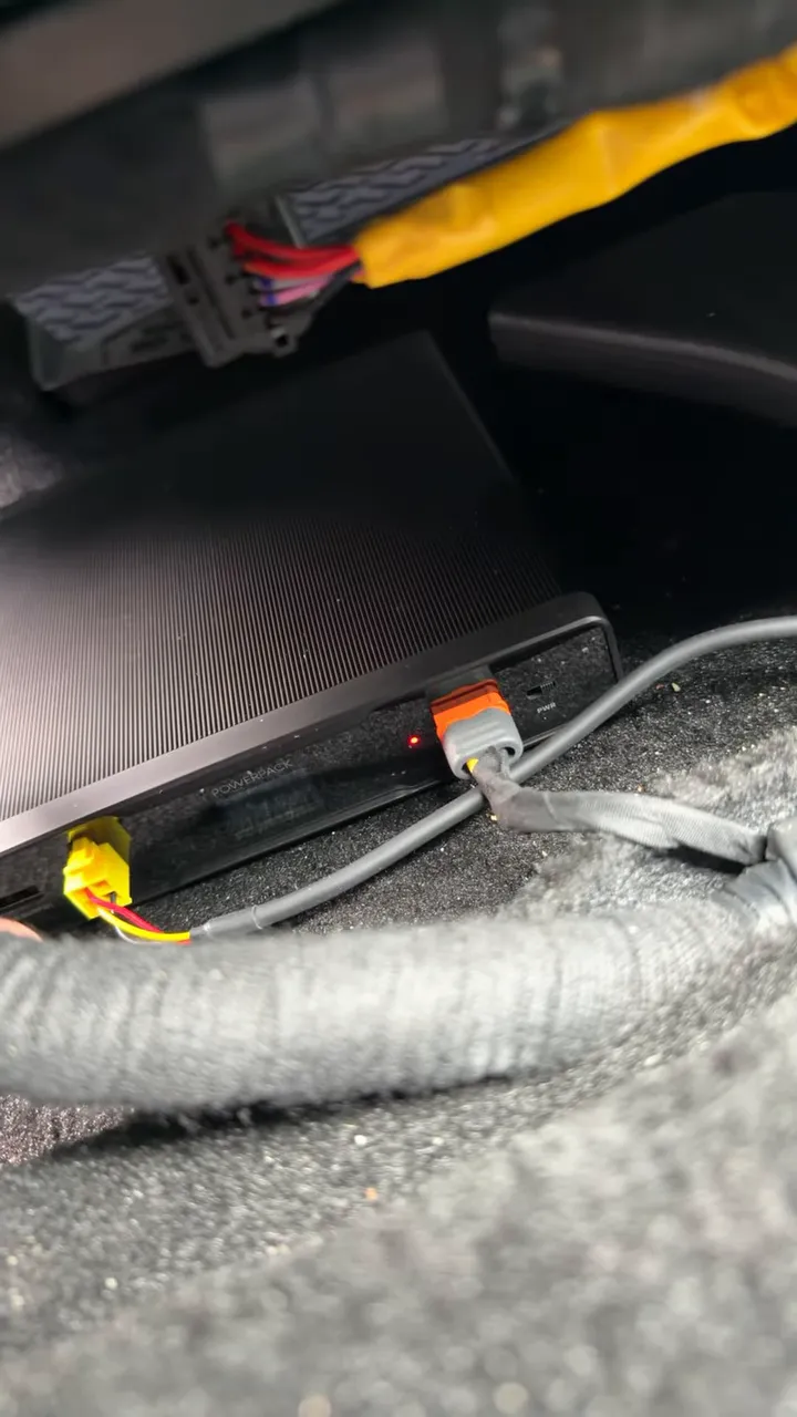 Battery pack charging light and power wiring under passenger seat in 2026 Hyundai Tucson Hybrid