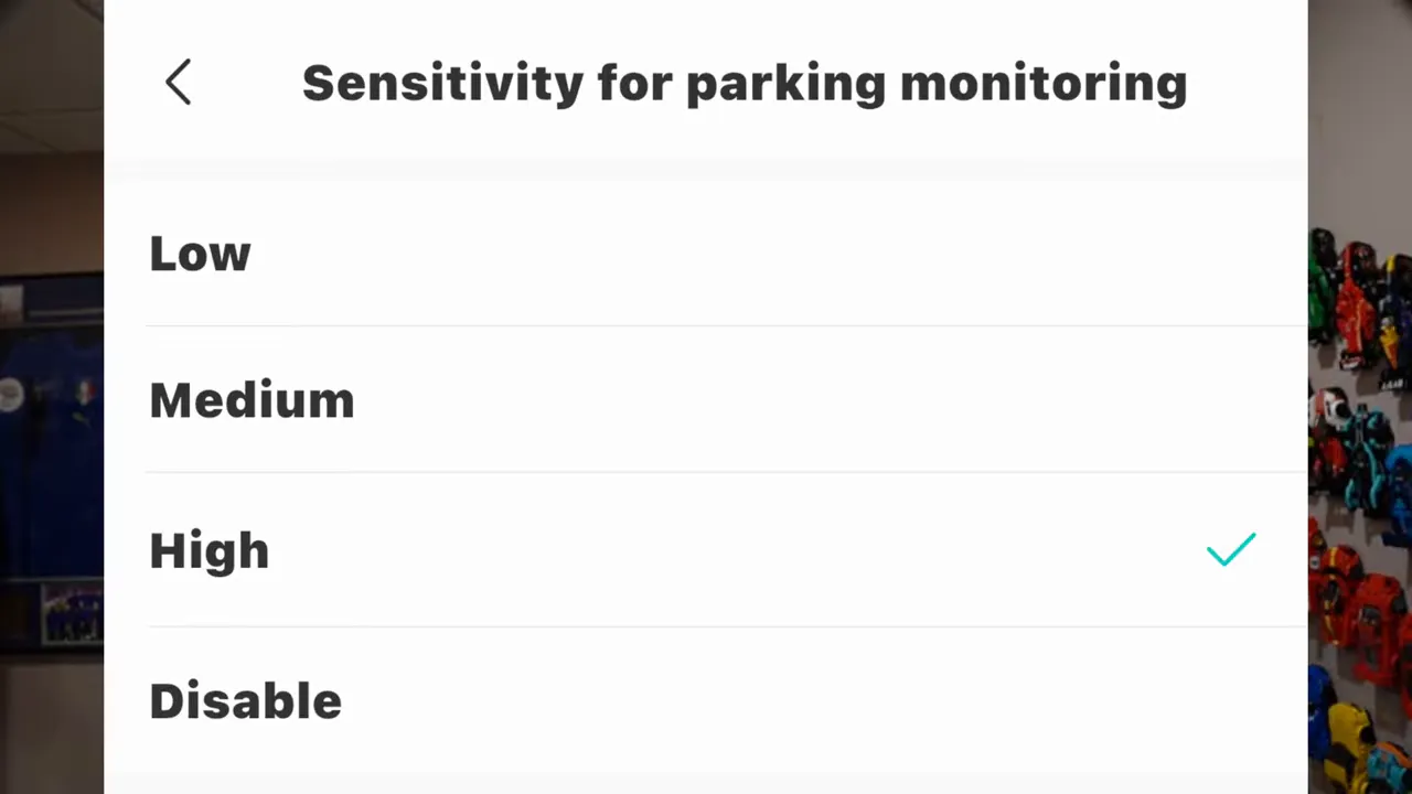 Phone app menu for sensitivity for parking monitoring with Low, Medium, High and Disable options