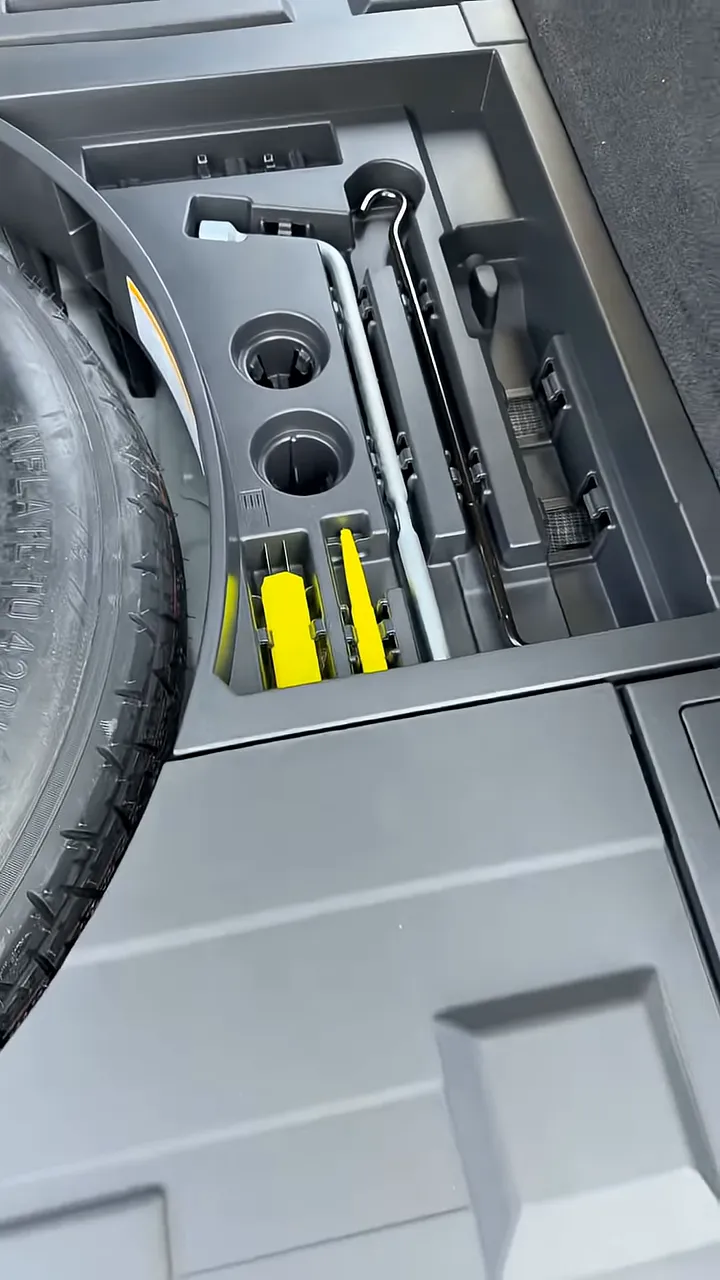 Clear view of Lexus RX350h hatch battery-access compartment with dash cam power wiring placement