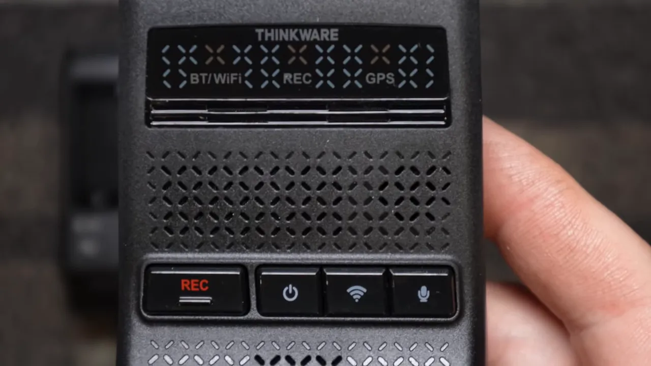 Thinkware U3000 Pro top controls showing REC power wifi and mic buttons clearly