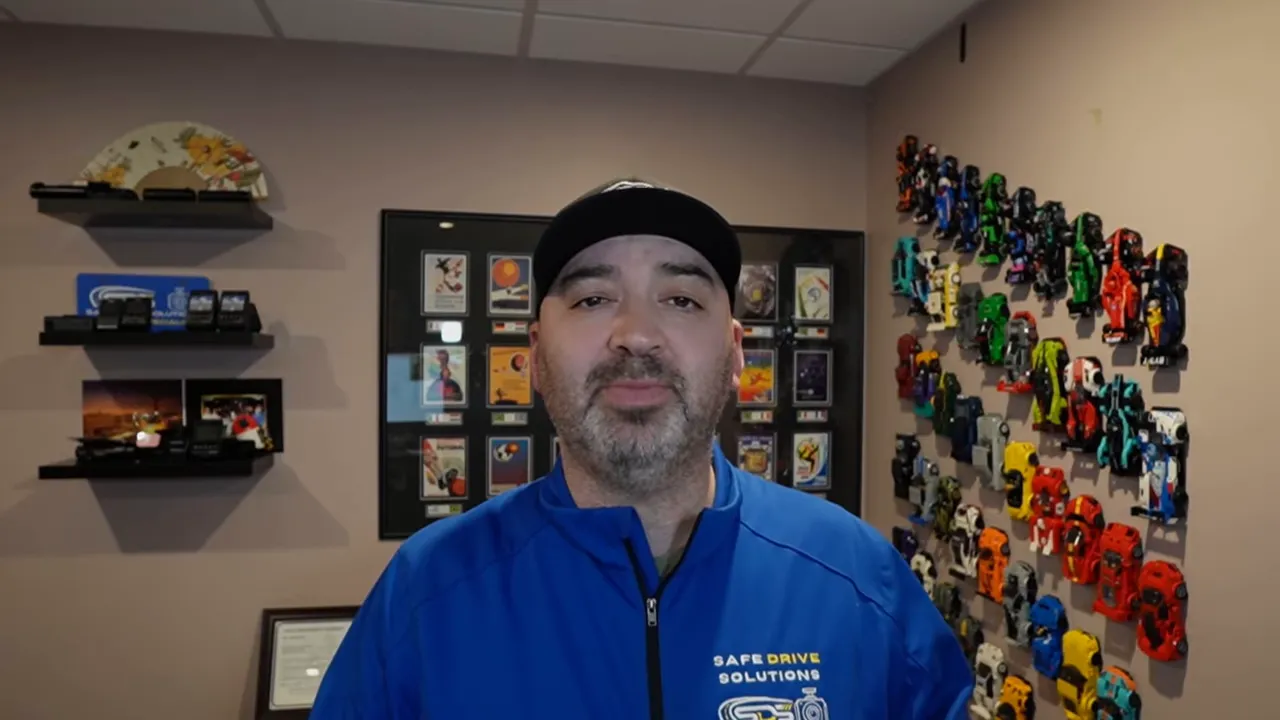 Presenter looking at camera while summarizing G-sensor sensitivity and detection consistency.