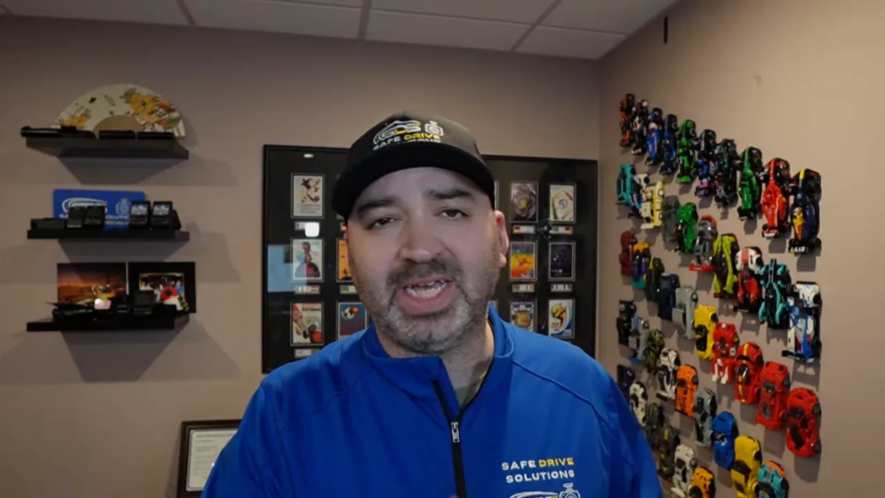 Well-framed presenter in office summarizing dash cam impact detection results