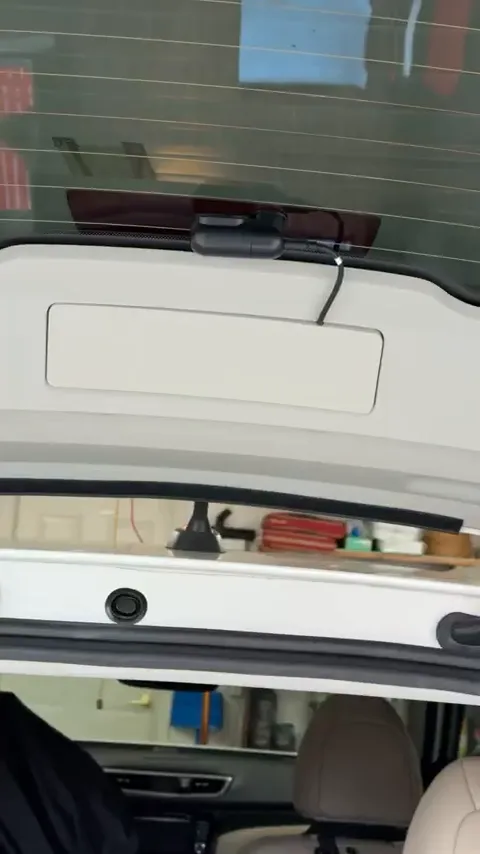 Close-up of incision in grommet after rear camera installation