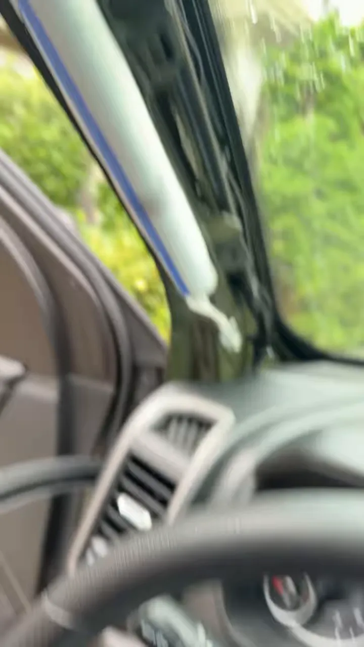 Exposed Ram 1500 A-pillar showing airbag material, factory harness, and routed dash cam cable