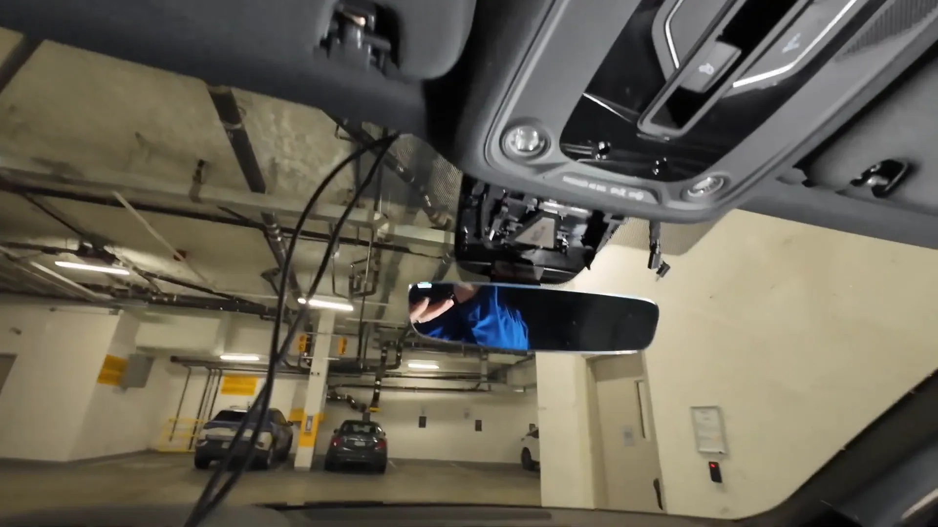 Tucking the wiring into the headliner.