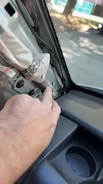 Cable routed over airbag canister