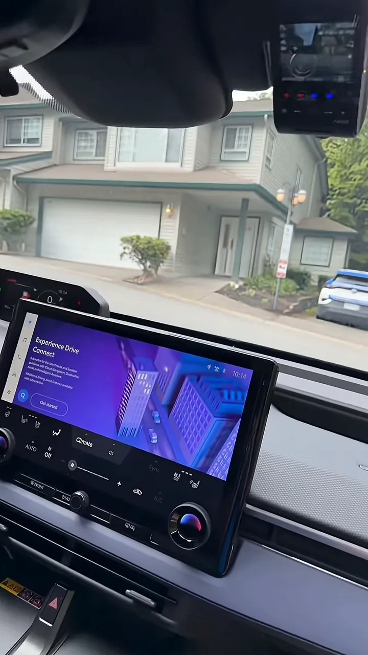 Front dash camera mounted high on the windshield below the headliner