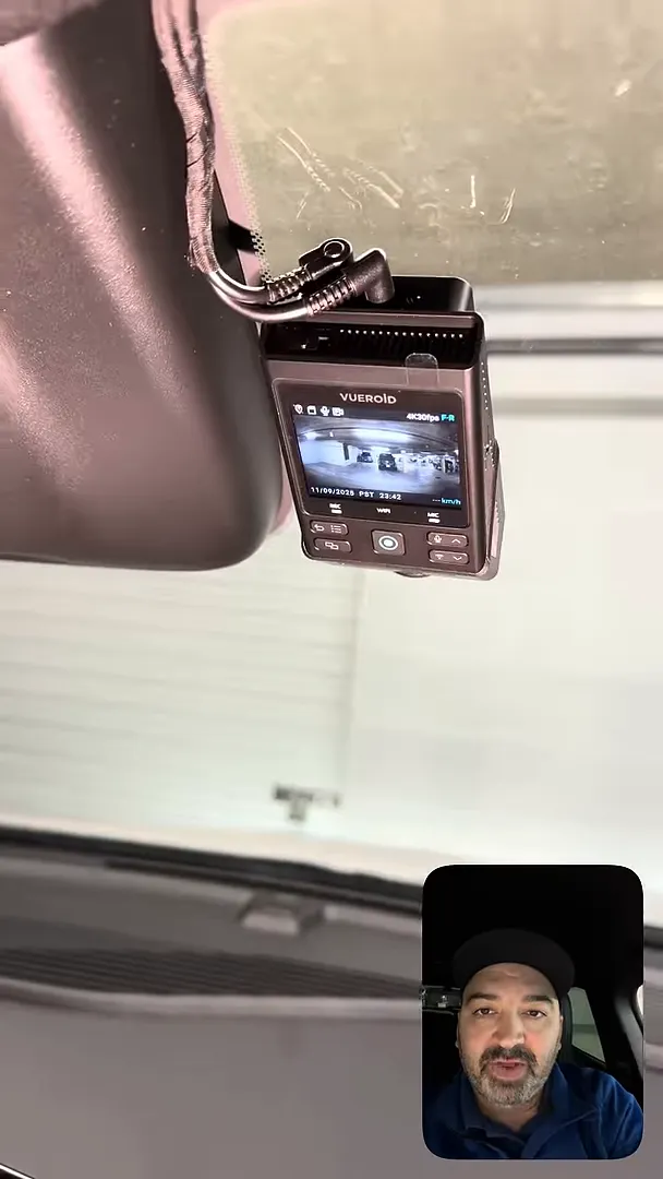 Veroid dash camera display mounted near the mirror showing the front camera feed and 4K recording indicator with presenter inset
