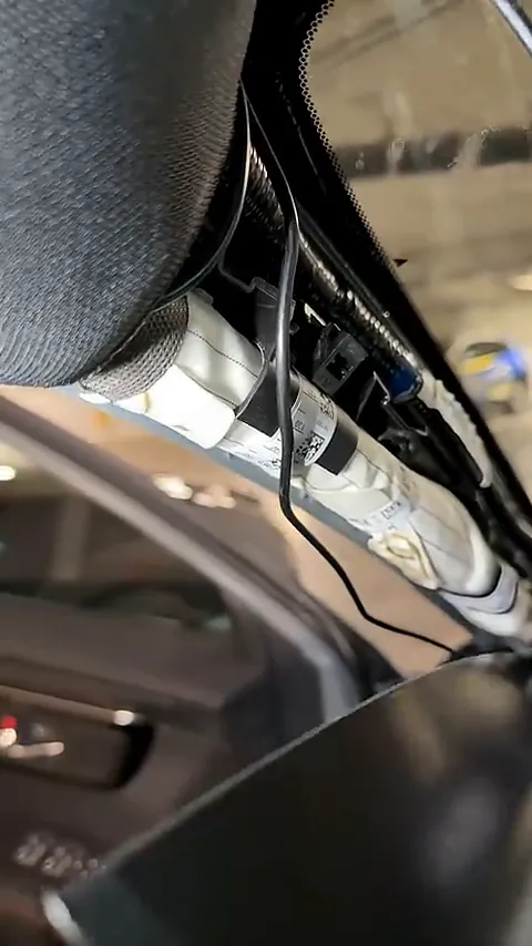 Wiring clearly running over the airbag despite competitor claims