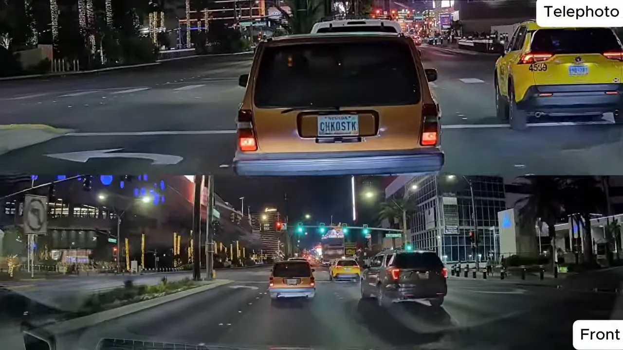 Telephoto dash cam frame at night with a readable license plate on the car ahead