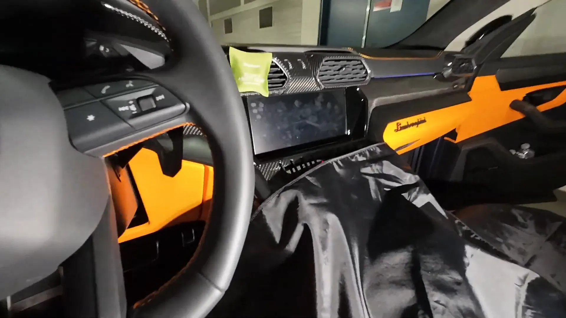Protective covers placed on seats and center console before starting work
