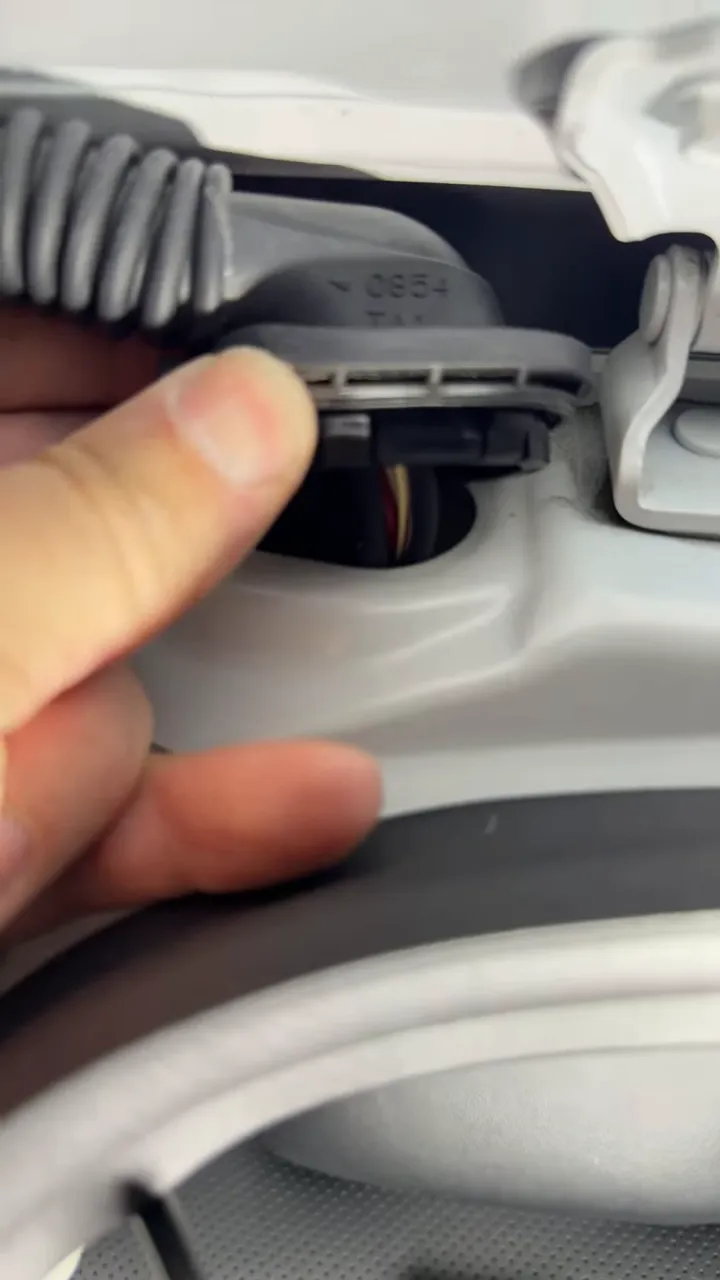 Factory hatch wiring boot connector released from body opening