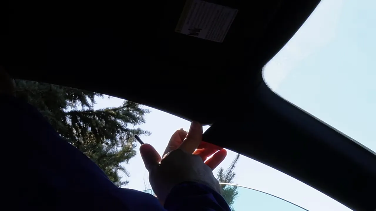 Trim hook lifting A-pillar clip with fingers creating gap
