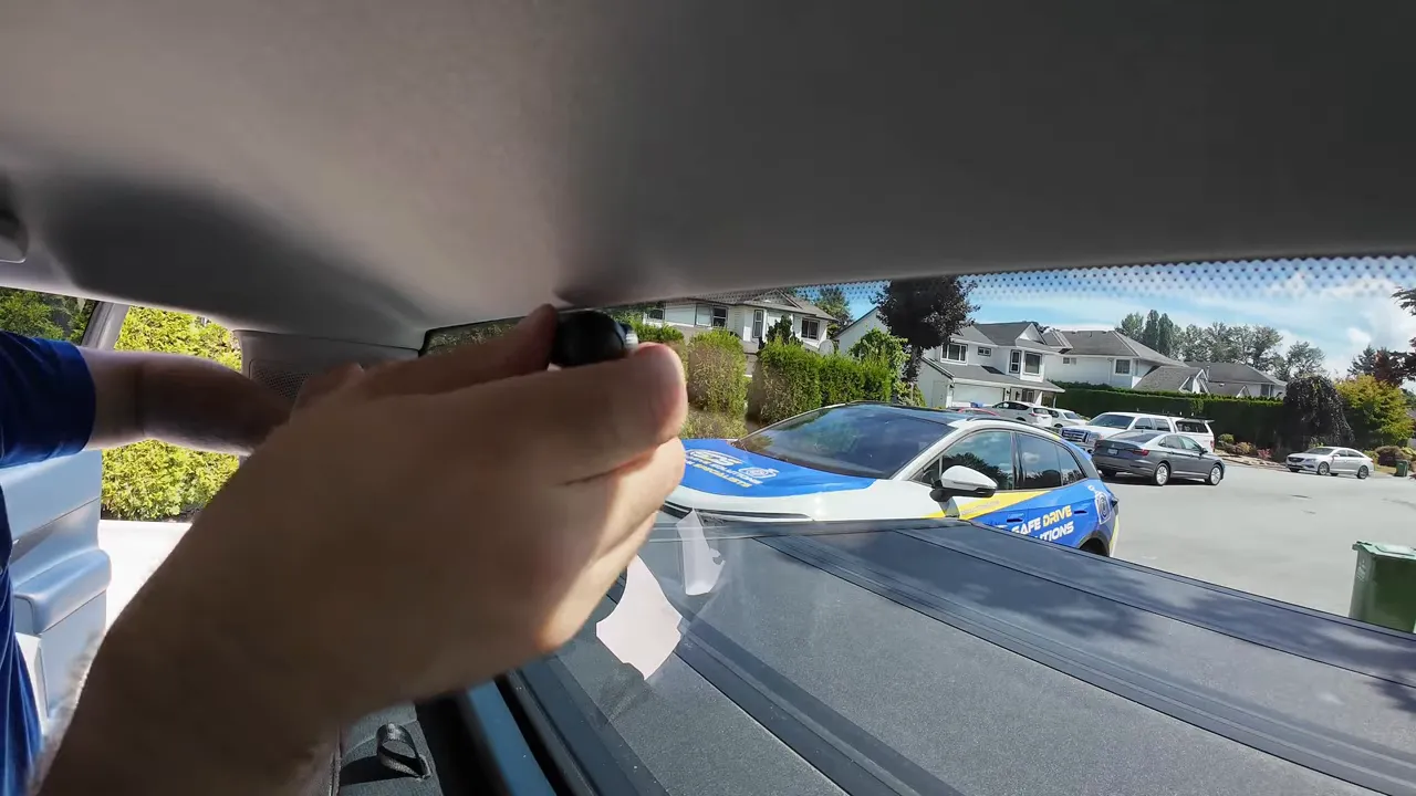 Rear dash camera being positioned on the Ford Maverick rear window
