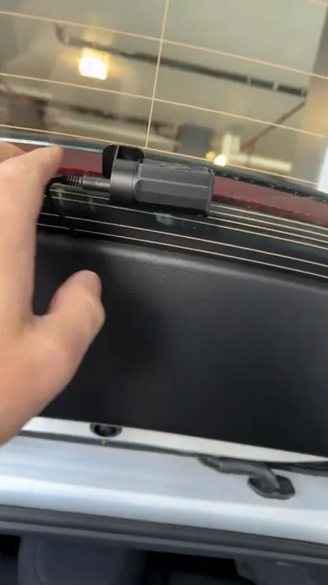 OBD2 cable plugged into Mazda 3 dash camera power port