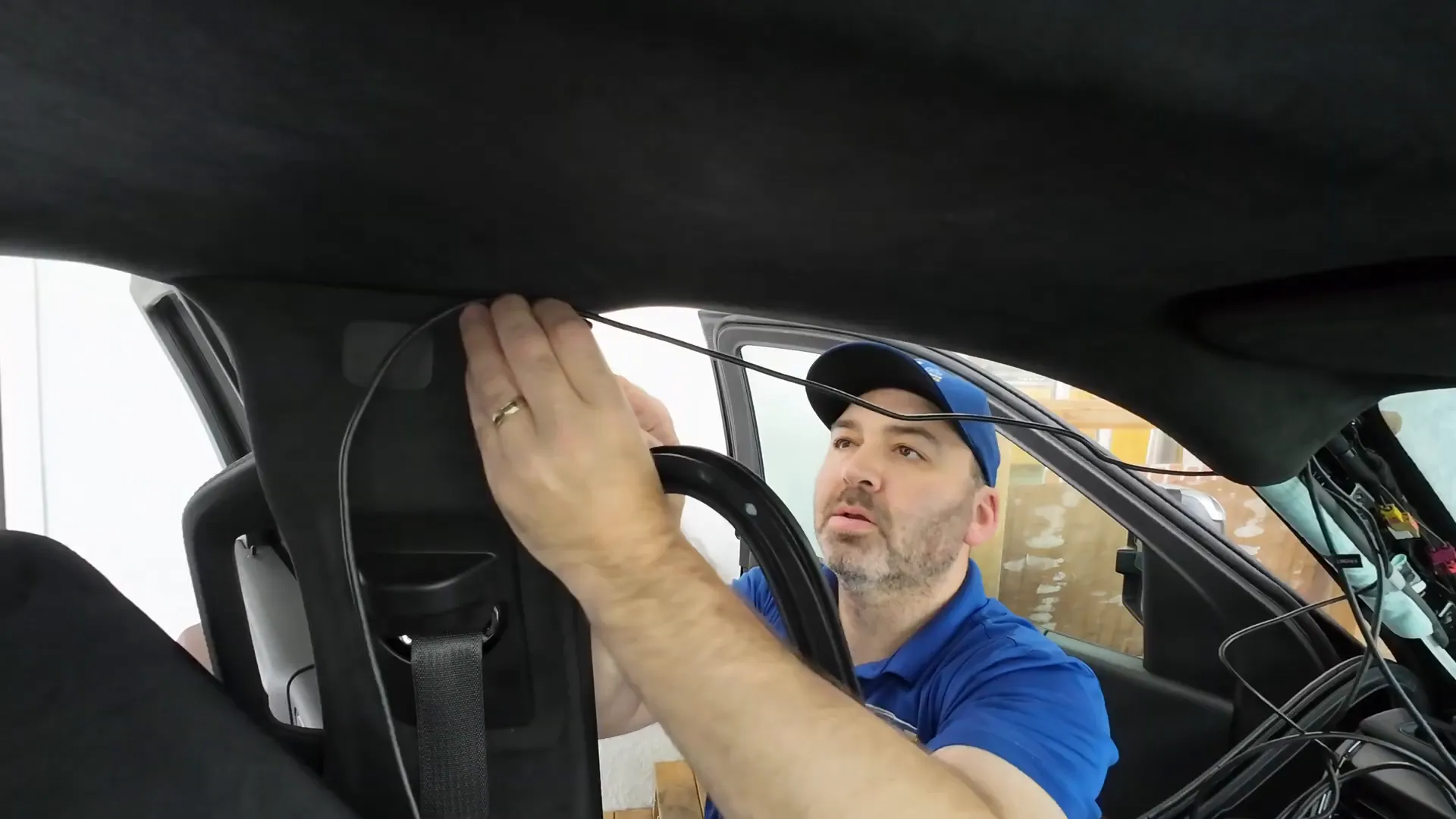 Removing weather stripping to route rear camera wiring